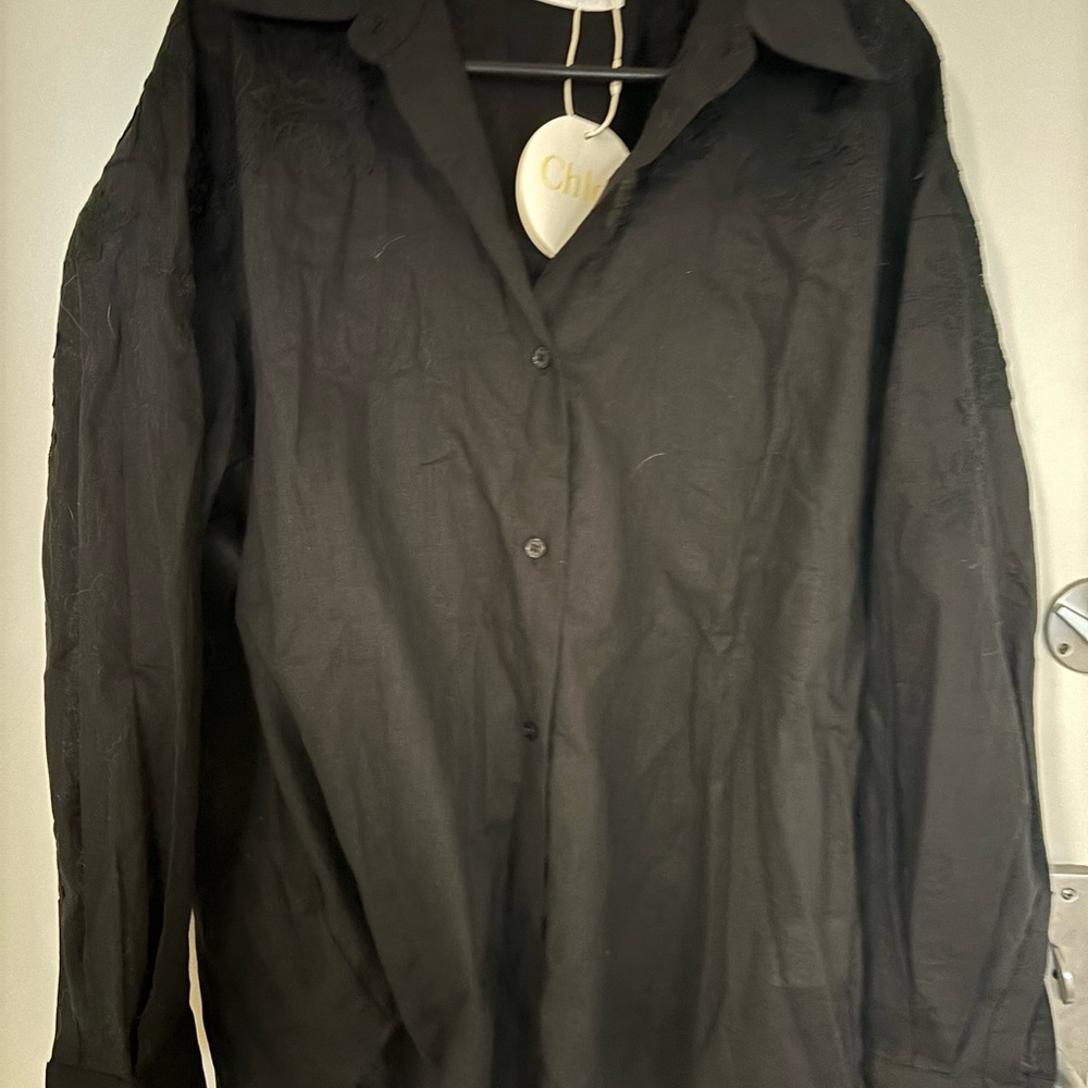 Chloe Black Linen Button-Up Shirt with floral details on shoulders